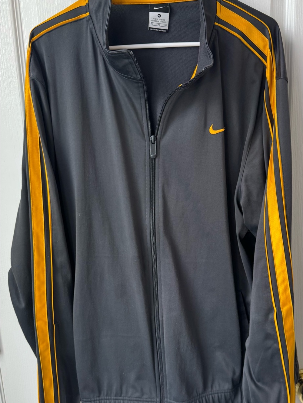 Nike Black and yellow track jacks with yellow stripes on sleeves in x-large in